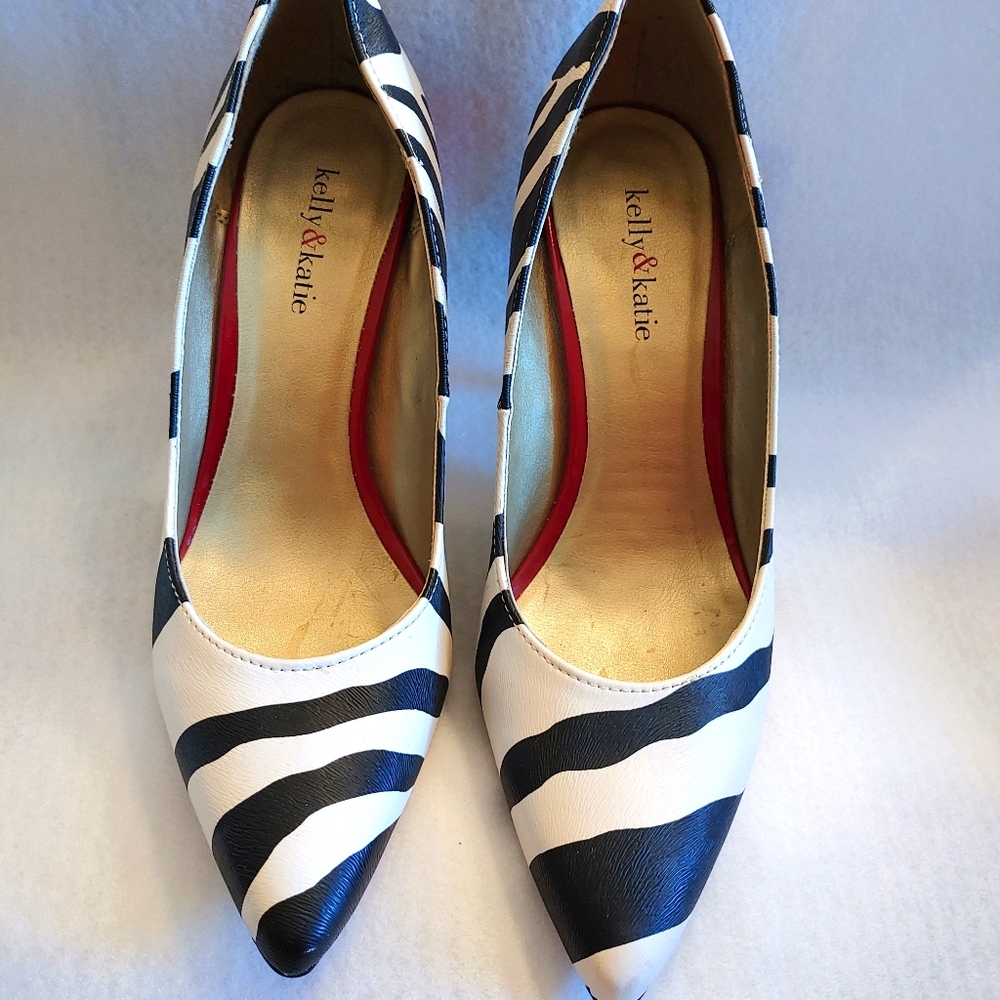 Zebra pumps with red heels